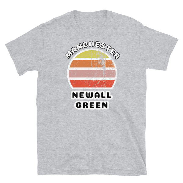 Distressed style abstract retro sunset graphic in yellow, orange, pink and scarlet stripes. The name of Manchester is displayed at the top wrapped around the sunset. Below the retro sunset design is the famous Manchester place name of Newall Green on this light grey cotton t-shirt.