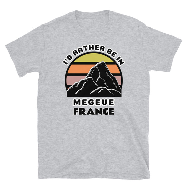 Megeve France vintage sunset mountain scene in silhouette, surrounded by the words I'd Rather Be In on top and Megeve, France below on this light grey cotton ski and mountain themed t-shirt