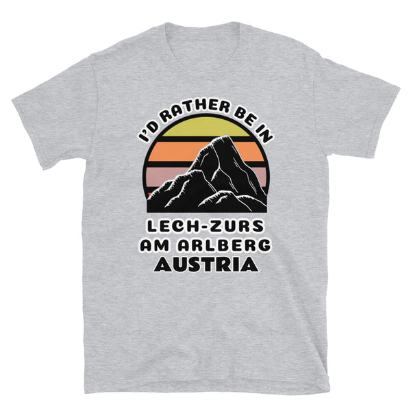 Lech-Zürs am Arlberg Austria vintage sunset mountain scene in silhouette, surrounded by the words I'd Rather Be In on top and Lech-Zürs am Arlberg, Austria below on this light grey cotton ski and mountain themed t-shirt