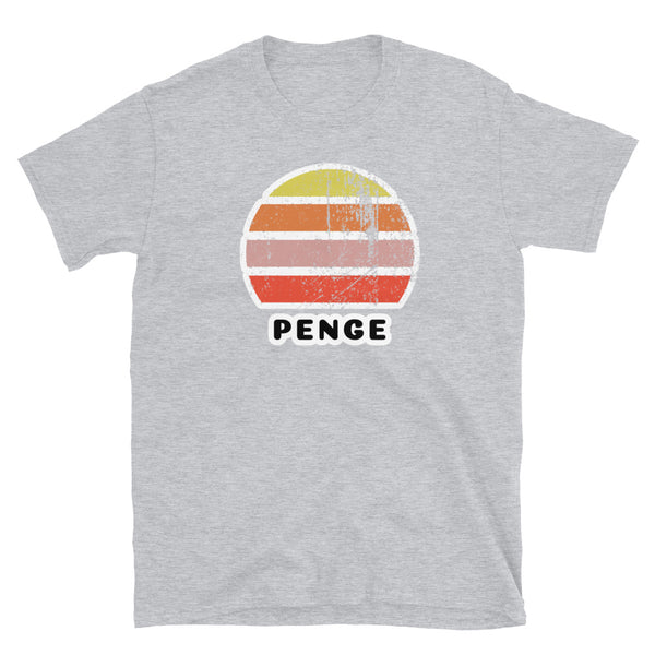 Vintage distressed style retro sunset in yellow, orange, pink and scarlet with the name Penge beneath on this light grey cotton t-shirt