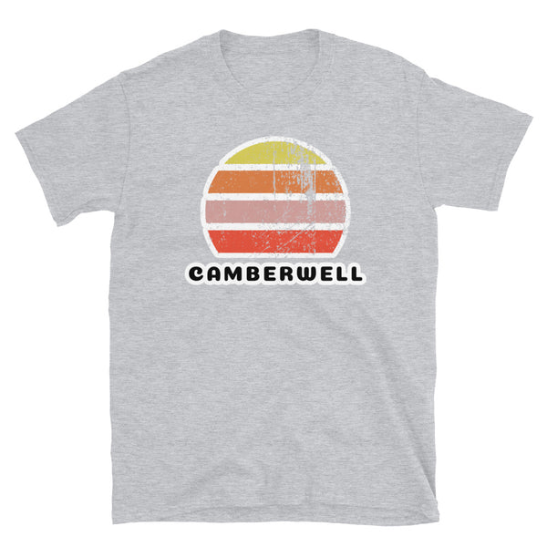 Vintage distressed style retro sunset in yellow, orange, pink and scarlet with the name Camberwell beneath on this light grey cotton t-shirt