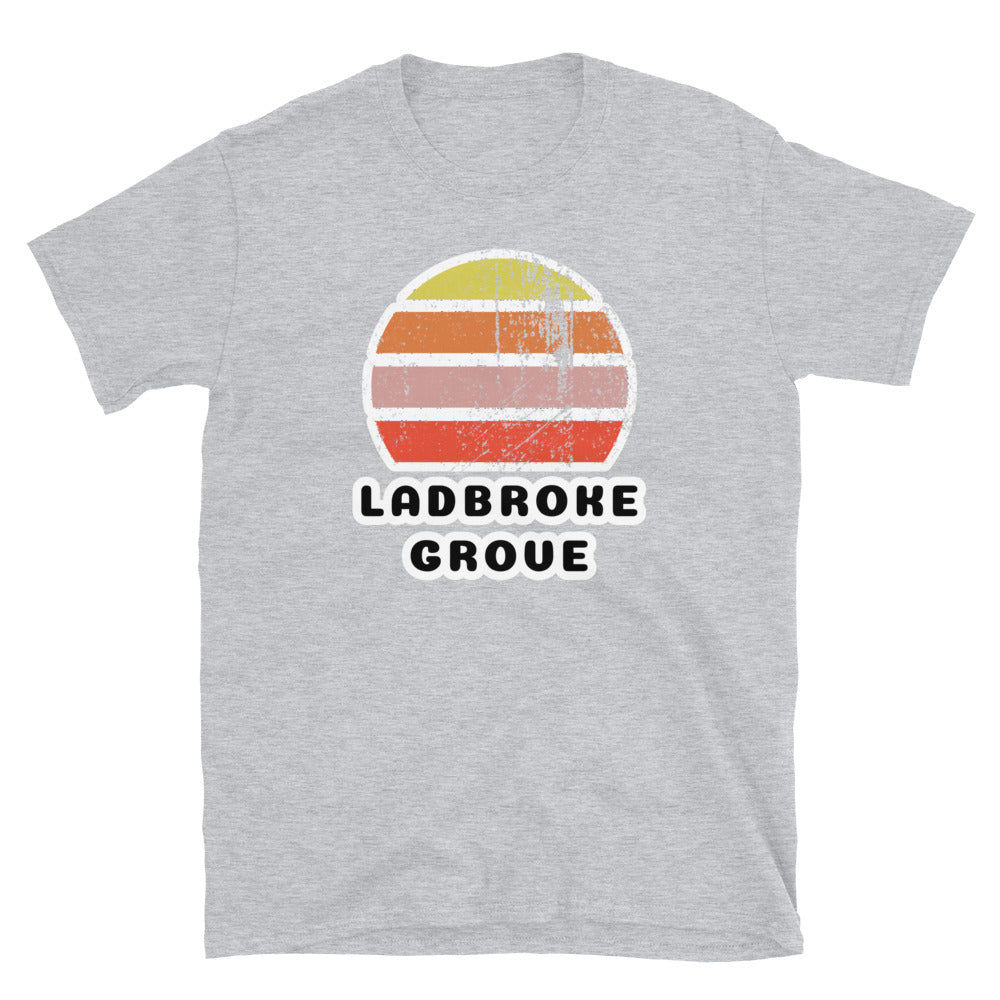 Vintage distressed style retro sunset in yellow, orange, pink and scarlet with the London neighbourhood of Ladbroke Grove beneath on this light grey cotton t-shirt