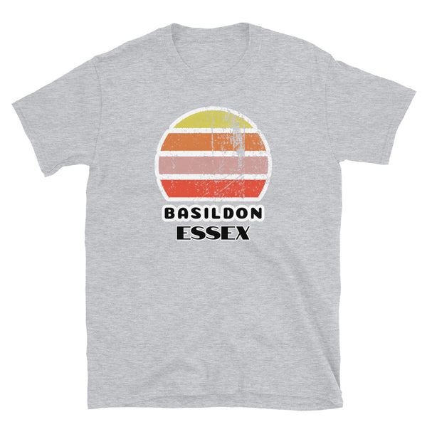 Vintage distressed style retro sunset in yellow, orange, pink and scarlet with the Essex neighbourhood of Basildon outlined beneath on this light grey cotton t-shirt