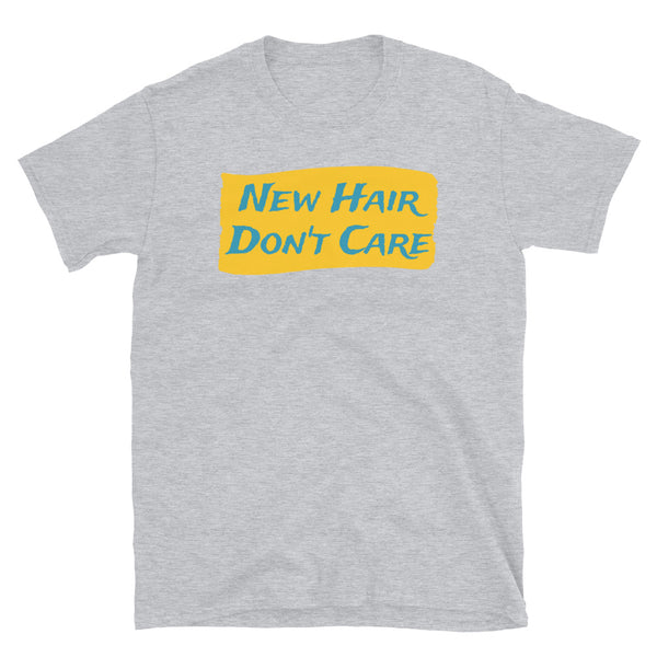 Funny slogan New Hair Don't Care in turquoise font on a splash of orange colour on this light grey cotton tee