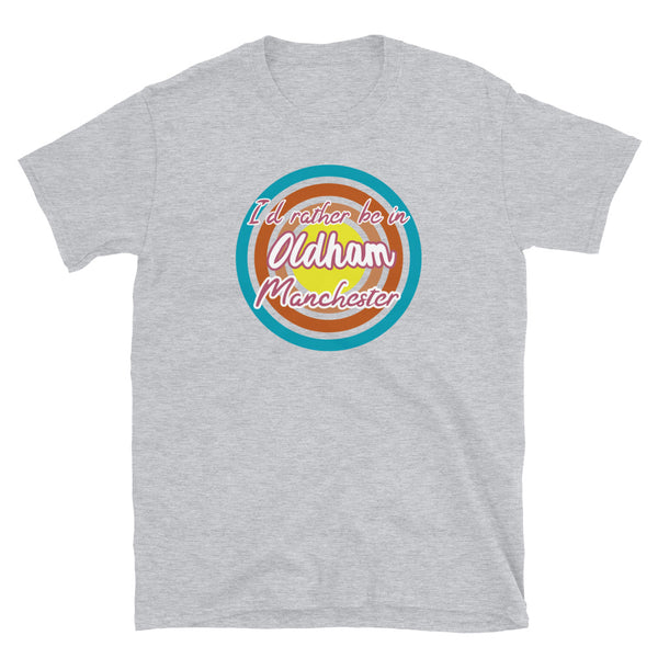 Oldham Manchester urban city vintage style graphic in turquoise, orange, pink and yellow concentric circles with the slogan I'd rather be in Oldham Manchester across the front in retro vintage style font on this light grey cotton t-shirt