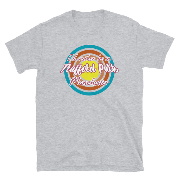 Trafford Park Manchester urban city vintage style graphic in turquoise, orange, pink and yellow concentric circles with the slogan I'd rather be in Trafford Park Manchester across the front in retro style font on this light grey cotton t-shirt