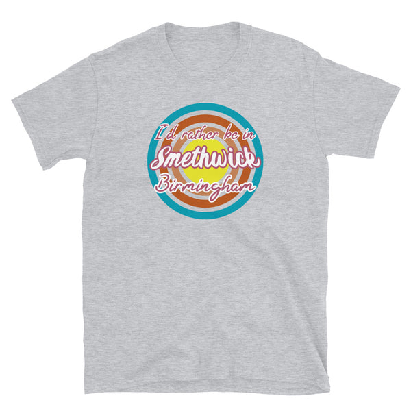 Smethwick Birmingham urban city vintage style graphic in turquoise, orange, pink and yellow concentric circles with the slogan I'd rather be in Smethwick Birmingham across the front in retro style font on this light grey cotton t-shirt