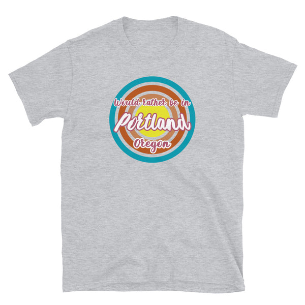 Rather be in Portland Oregon graphic t-shirt design with concentric circles in retro colours of blue, orange, pink and yellow on this light grey cotton tee by BillingtonPix