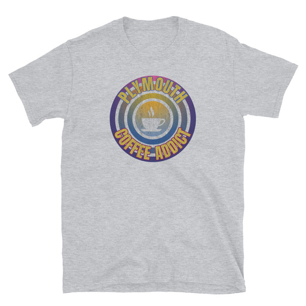 Concentric circular design of retro 80s metallic colours and the slogan Plymouth Coffee Addict with a coffee cup silhouette in the centre. Distressed and dirty style image for a vintage Retrowave look on this light grey cotton t-shirt by BillingtonPix