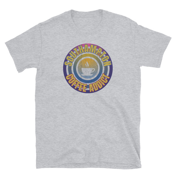 Concentric circular design of retro 80s metallic colours and the slogan Southampton Coffee Addict with a coffee cup silhouette in the centre. Distressed and dirty style image for a vintage Retrowave look on this light grey cotton t-shirt by BillingtonPix