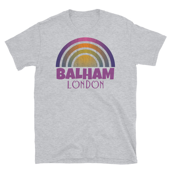 Retrowave and Vaporwave 80s style graphic gritty vintage sunset design tee depicting the London neighbourhood of Balham on this light grey souvenir cotton t-shirt