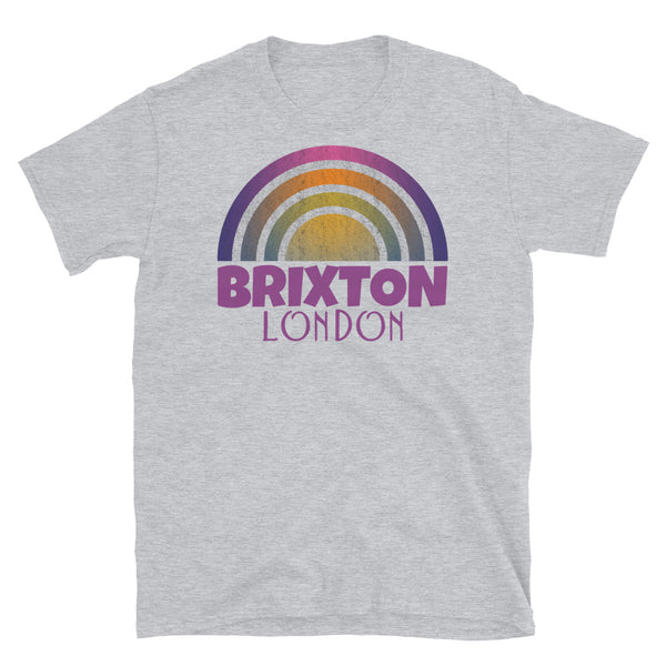 Retrowave and Vaporwave 80s style graphic gritty vintage sunset design tee depicting the London neighbourhood of Brixton on this light grey souvenir cotton t-shirt