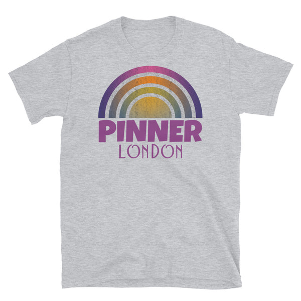 Retrowave and Vaporwave 80s style graphic gritty vintage sunset design tee depicting the London neighbourhood of Pinner on this light grey souvenir cotton t-shirt