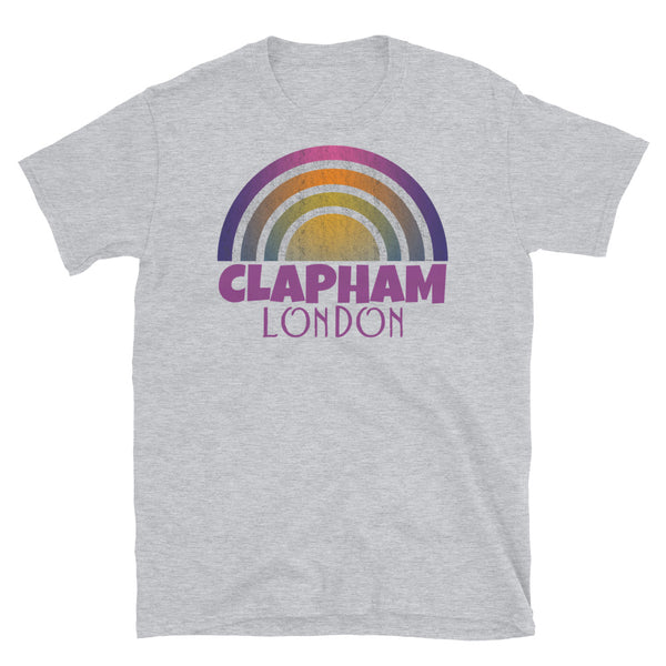 Retrowave and Vaporwave 80s style graphic gritty vintage sunset design tee depicting the London neighbourhood of Clapham on this light grey souvenir cotton t-shirt