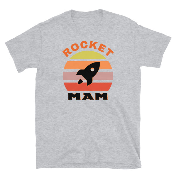 Rocket Mam funny graphic t-shirt with a black rocket outline against a vintage sunset graphic design in yellow, orange, pink and scarlet on this light grey cotton t-shirt by BillingtonPix