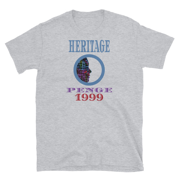 Graphic t-shirt with a patterned profile face in abstract design, tones of blue, green, purple, red, in circular format, with the words Heritage Penge 1999 in blue, purple and red on this sport grey cotton t-shirt by BillingtonPix
