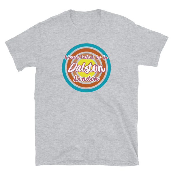 Dalston urban city vintage style graphic in turquoise, orange, pink and yellow concentric circles with the slogan I'd rather be in Dalston London across the front in retro style font on this light grey cotton t-shirt