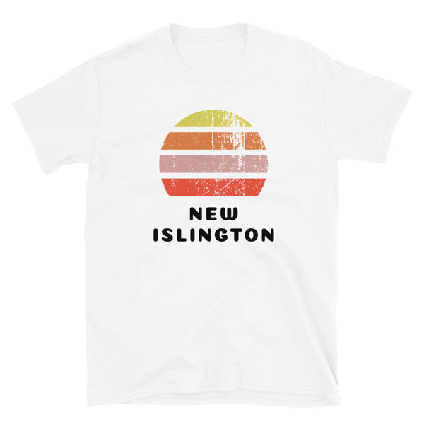 Features a distressed abstract retro sunset graphic in yellow, orange, pink and scarlet stripes rising up from the famous Manchester place name of New Islington on this white t-shirt