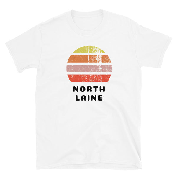 Features a distressed abstract retro sunset graphic in yellow, orange, pink and scarlet stripes rising up from the famous Brighton place name of North Laine on this white t-shirt