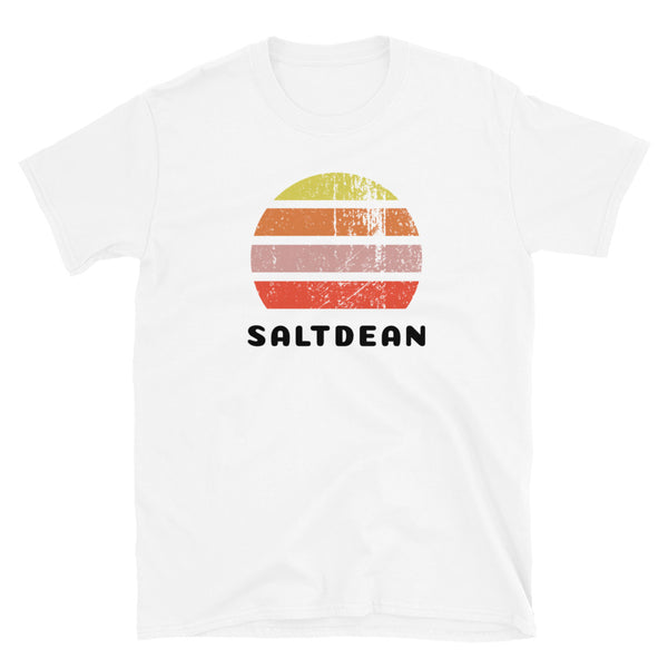 Features a distressed abstract retro sunset graphic in yellow, orange, pink and scarlet stripes rising up from the famous Brighton place name of Saltdean on this white t-shirt