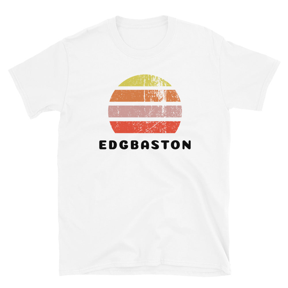 Features a distressed abstract retro sunset graphic in yellow, orange, pink and scarlet stripes rising up from the famous Birmingham place name of Edgbaston on this white cotton t-shirt