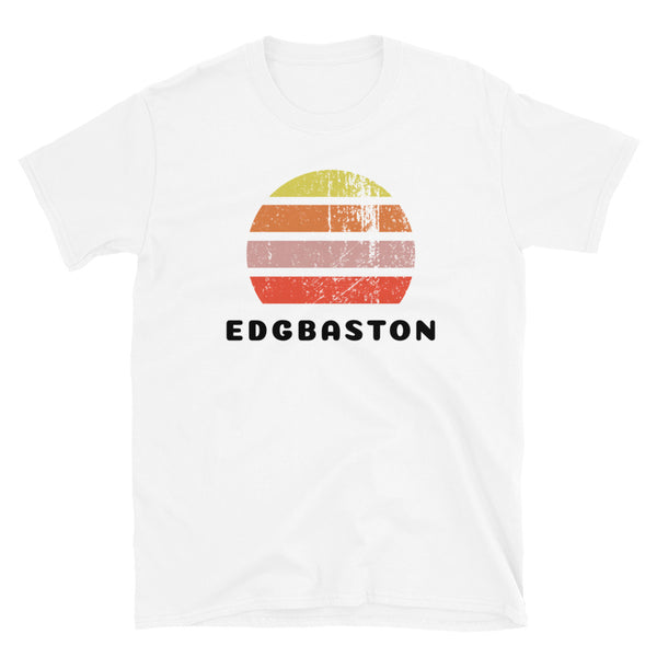 Features a distressed abstract retro sunset graphic in yellow, orange, pink and scarlet stripes rising up from the famous Birmingham place name of Edgbaston on this white cotton t-shirt