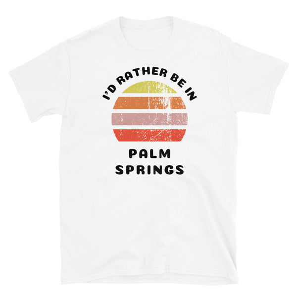Vintage distressed style abstract retro sunset in yellow, orange, pink and scarlet with the words I'd Rather Be In above and the name Palm Springs beneath on this white cotton t-shirt