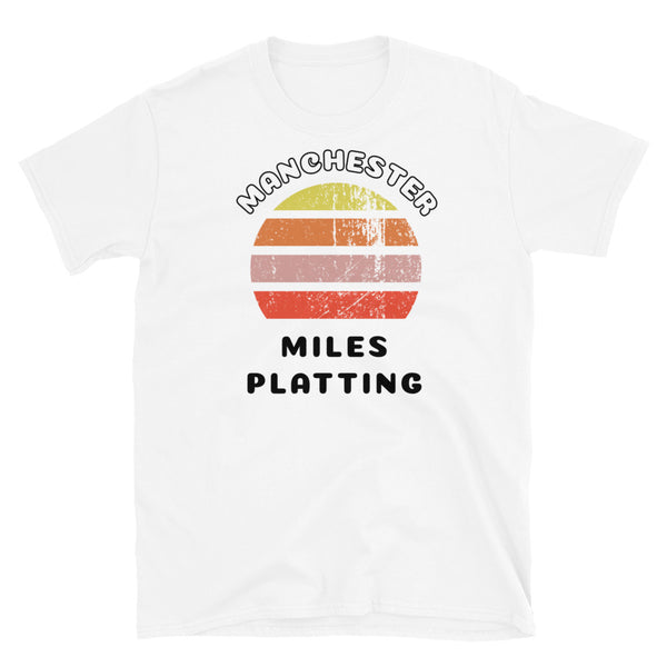 Distressed style abstract retro sunset graphic in yellow, orange, pink and scarlet stripes. The name of Manchester is displayed at the top wrapped around the sunset. Below the retro sunset design is the famous Manchester place name of Miles Platting on this white cotton t-shirt.