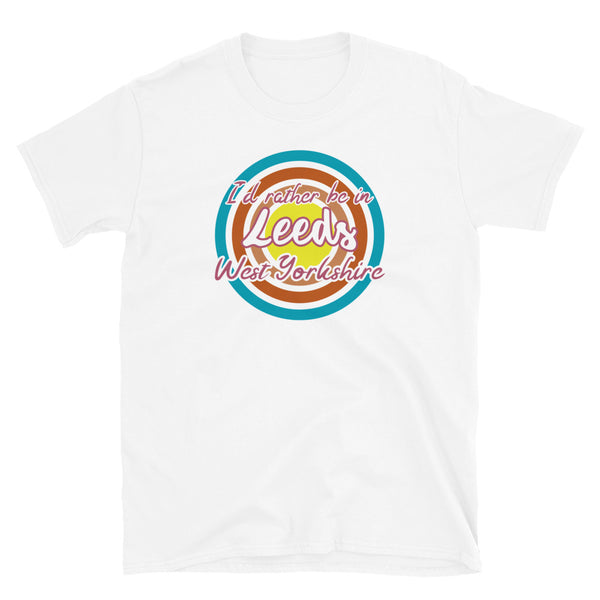 Leeds West Yorkshire urban city vintage style graphic in turquoise, orange, pink and yellow concentric circles with the slogan I'd rather be in Leeds West Yorkshire across the front in retro style font on this white cotton t-shirt
