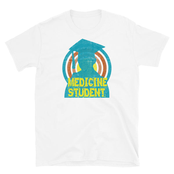 Medicine Student novelty tee with a distressed style turquoise silhouetted student against a concentric circular design and the words Medicine Student in bold yellow font on this white cotton fun graphic t-shirt by BillingtonPix