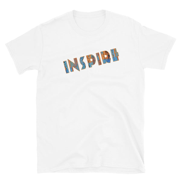 Inspirational slogan graphic Inspire t shirt with the single word Inspire filled with vintage pattern burnt orange, turquoise blue and taupe tones and displayed on this white cotton t-shirt by BillingtonPix in an energetic diagonal slant 