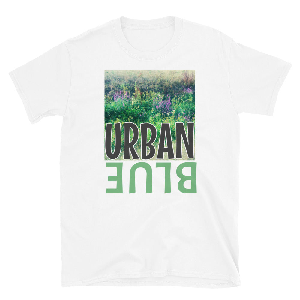 Graphic t-shirt showing a photographic nature scene of wild flowers with the word URBAN overlaid on top and the word BLUE in green font and mirrored format below on this white cotton tee by BillngtonPix