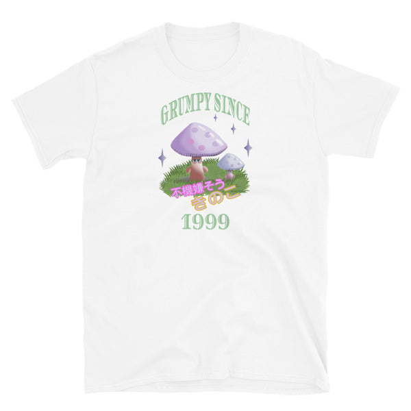 Cute Japanese Kawaii style graphic tee with a cottagecore style theme of woodland mushrooms. Muted tones in a retro vintage 90s Japanese style in pale pinks, mauves and green. These are grumpy mushrooms and the slogan Grumpy Since 1999 and 不機嫌そうなキノコ describe this white cotton t-shirt by BillingtonPix