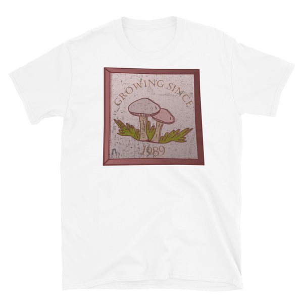 Growing since 1989 cute Goblincore style design with two mushrooms in muted tones and a glass framed effect with distressed look on this white cotton t-shirt by BillingtonPix
