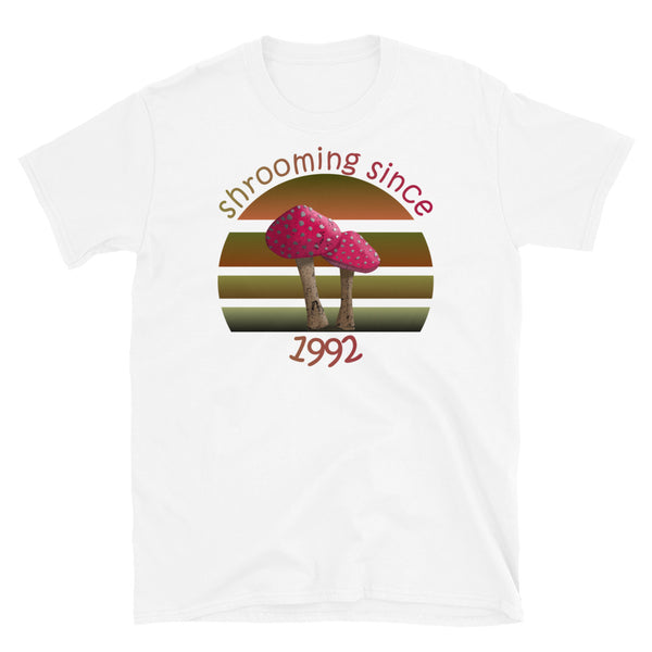 Shrooming since 1992 cute Goblincore style design with two red fly agaric mushrooms with distressed look against a multi-toned nature colour palette abstract vintage sunset design on this white cotton t-shirt by BillingtonPix
