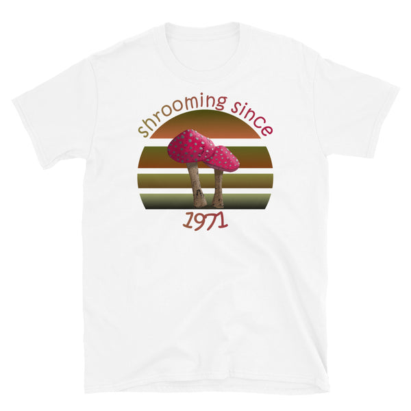 Shrooming since 1971 cute Goblincore style design with two red fly agaric mushrooms with distressed look against a multi-toned nature colour palette abstract vintage sunset design on this white cotton t-shirt by BillingtonPix