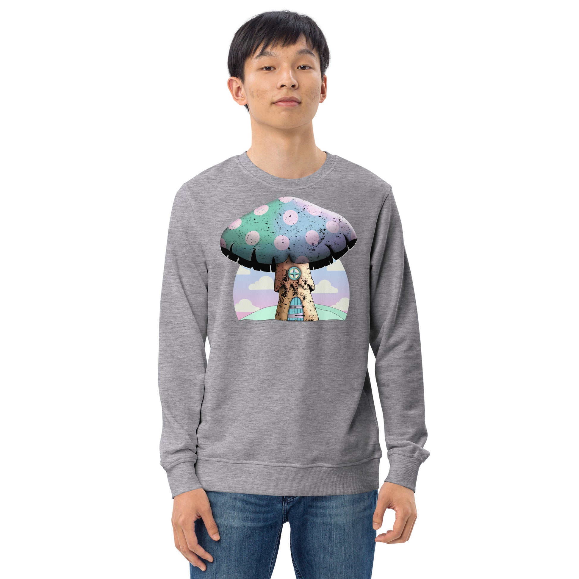 Cute mushroomcore themed organic sweatshirt with an anime mushroom house against an abstract pink cloudy sky. Mushroom house has a door and window in old wood style and the large cap of the mushroom is rainbow colored with pink spots. Very cute indeed. Graphic organic sweatshirt by BillingtonPix