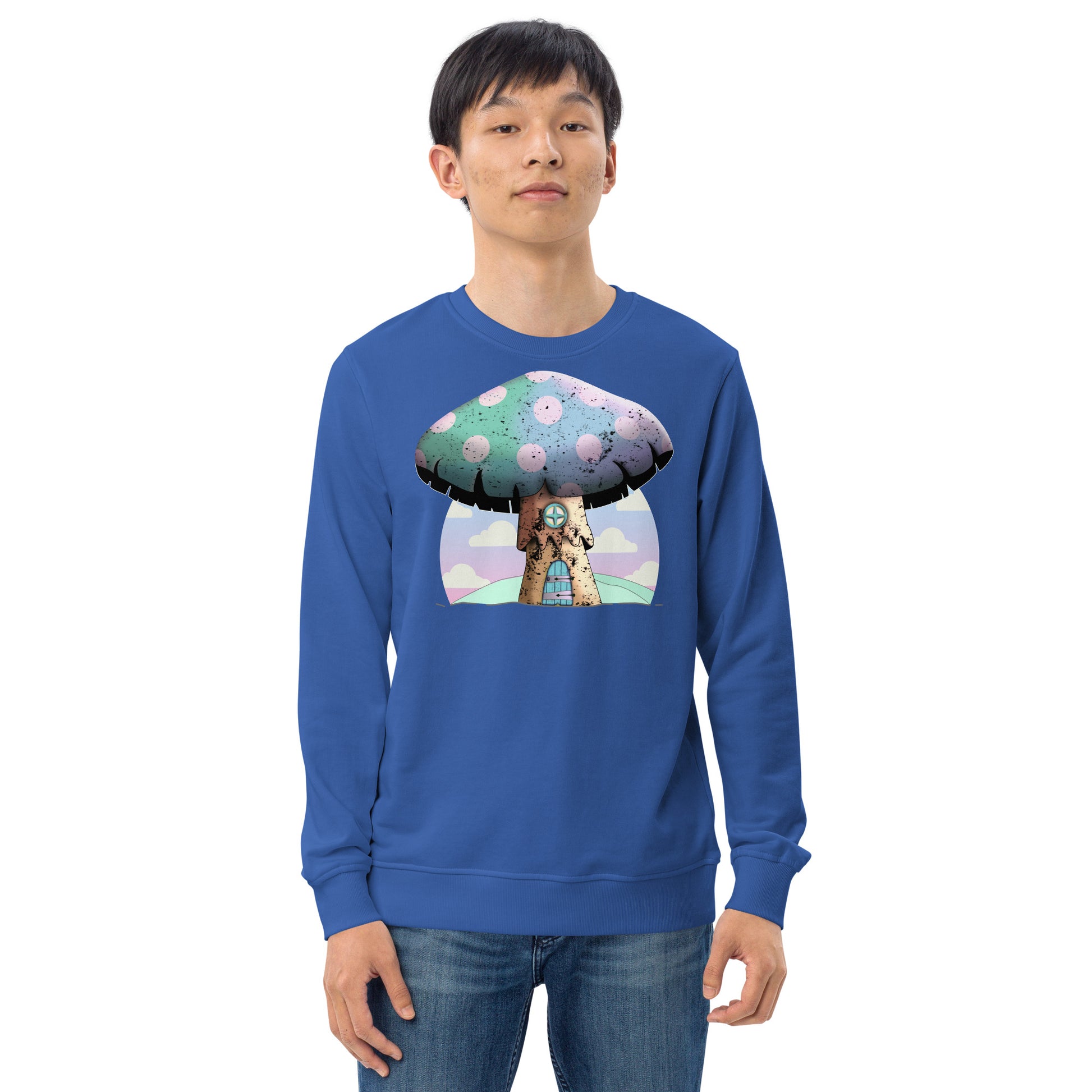 Cute mushroomcore themed organic sweatshirt with an anime mushroom house against an abstract pink cloudy sky. Mushroom house has a door and window in old wood style and the large cap of the mushroom is rainbow colored with pink spots. Very cute indeed. Graphic organic sweatshirt by BillingtonPix